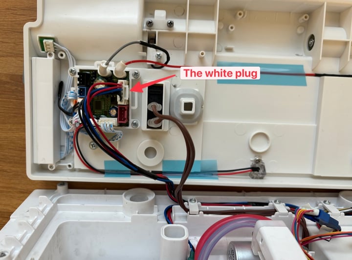 Field-service reference photo of internal transfer board and power connector